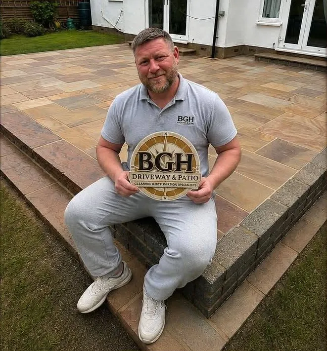 Ben from BGH, a traditional stonemason, on a finished sandstone patio