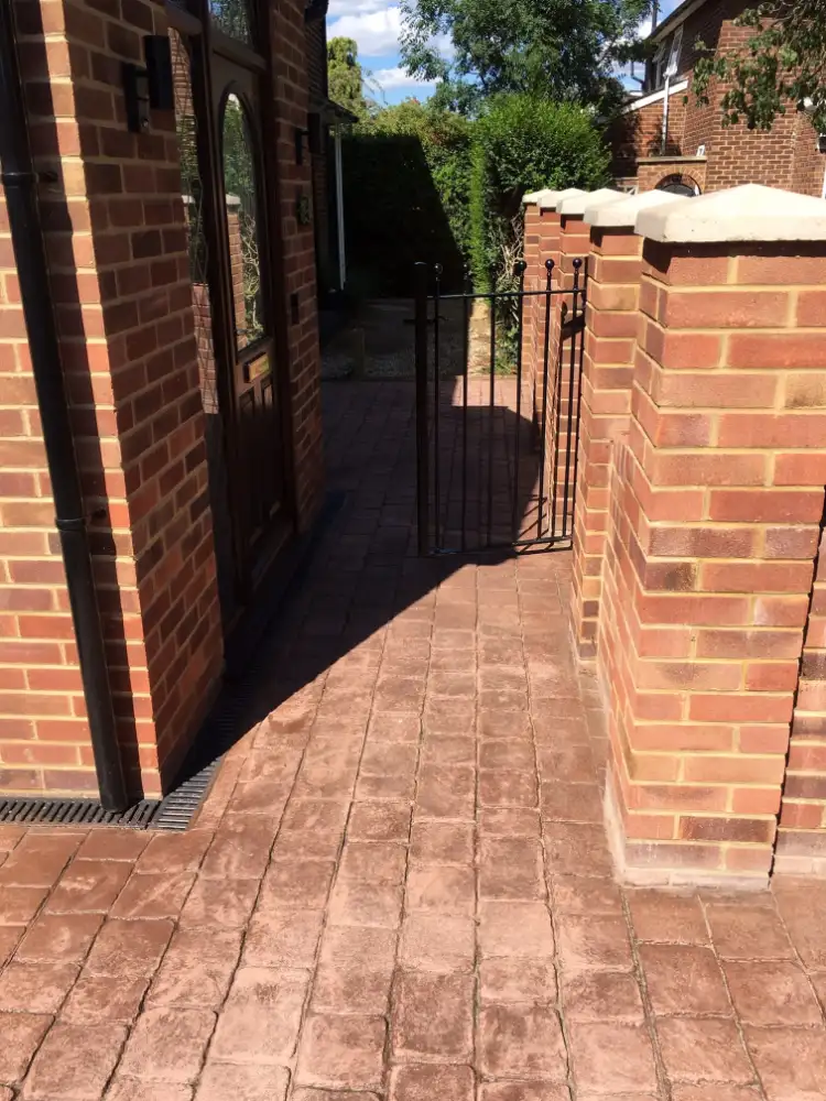 Brick pillars and imprinted concrete path
