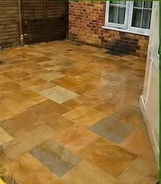 The same sandstone patio after cleaning and restoration